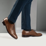 Styled Fit Perspective of Director Wholecut Tan Leather Shoes on Model - Natural Daylight Drape