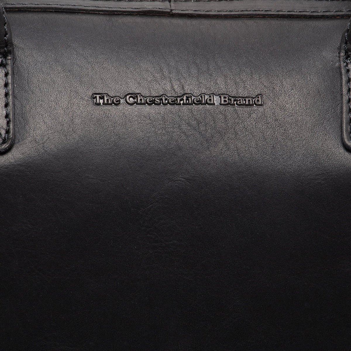Close-Up Detail of Classic Collar &amp; Heavy-Duty Zipper Hardware on Langton Full-Grain Leather Handbag